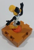 1996 McDonald's Warner Bros Looney Tunes Space Jam Daffy Duck on a Basketball Puzzle Pieces Shaped Plastic Toy Figure