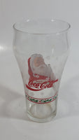 Enjoy Coca-Cola Santa Claus Holding a Bottle with Snowflakes and Holly Border Christmas Holiday Themed 6" Tall Glass Cup