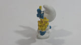 Vintage 1980 Peyo Smurf Character Holding and Eating French Fries PVC Toy Figure
