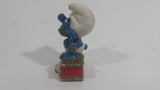 Vintage 1983 Peyo Smurf Character Talking on a Retro Rotary Red Telephone PVC Toy Figure