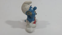 Vintage 1983 Peyo Smurf Character Talking on a Retro Rotary Red Telephone PVC Toy Figure