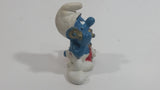 Vintage 1983 Peyo Smurf Character Talking on a Retro Rotary Red Telephone PVC Toy Figure