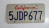 1996-97 California in Red on White with Blue Letters Vehicle License Plate 5JDP677