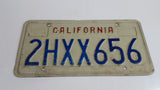1990-95 California in Red on White with Blue Letters Vehicle License Plate 2HXX656