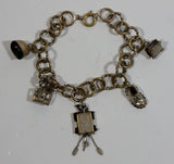Mountain Log Cabin, Gondola, Boots, Cuckoo Clock, and Flower Dinner Bell Themed Charms 8" Long Metal Bracelet