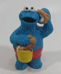 Applause Muppets Sesame Street Cookie Monster Character In Beach Shorts with a Pail of Shells Holding a Conch Shell To His Ear 3" Tall Hard Rubber PVC Toy