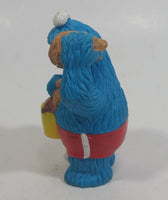 Applause Muppets Sesame Street Cookie Monster Character In Beach Shorts with a Pail of Shells Holding a Conch Shell To His Ear 3" Tall Hard Rubber PVC Toy