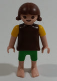 Geobra Playmobil Brown Haired Girl Green Shorts Brown Top Yellow Sleeves 2" Tall Toy Figure
