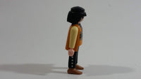 1994 Geobra Playmobil Black Haired Pirate Man Black Bottoms Tan Orange Top White Sleeves Stubble and Eye patch 3" Tall Toy Figure