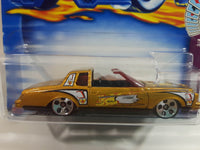 2002 Hot Wheels Trump Cars Montezooma Metalflake Gold Die Cast Toy Car Vehicle New in Package