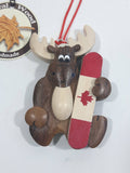 Moose Holding a Canadian Flag Snowboard Handmade Natural Wood Hanging Ornament
