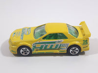 2004 Hot Wheels Truckin' Transporters Nissan Skyline Yellow Die Cast Toy Car Vehicle