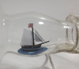 Vintage Highly Detailed HMS Surprise British Flagged Captured French Naval Tall Ship with Small Skiff Life Boat Sail Boat in 10 1/4" Long Glass Bottle