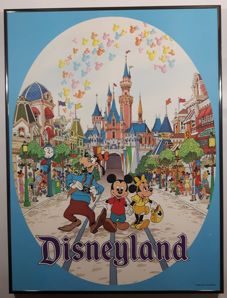 Walt Disney Productions Disneyland Goofy, Mickey Mouse and Minnie Mouse On Street with Castle Behind Them Large 18" x 24" Framed Hardboard Poster