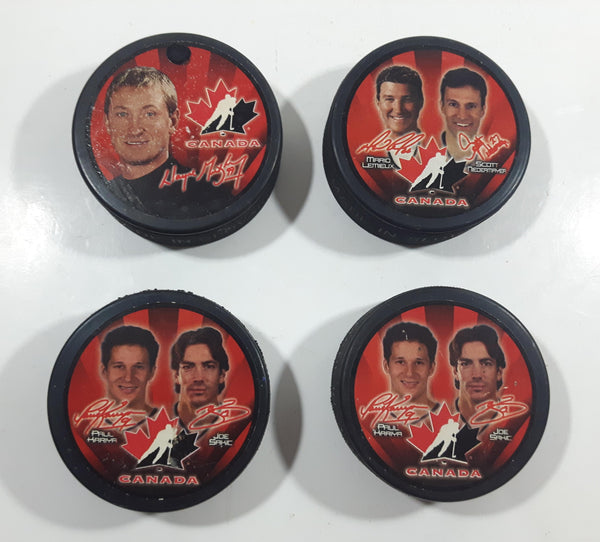 2002 McDonald's Salt Lake City Olympics Team Canada NHL Ice Hockey Players Set of 4 Pucks Gretzky, Lemieux, Niedermayer, Kariya, Sakic