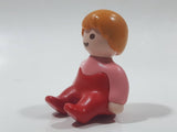 1990 Geobra Playmobil Female Girl Pink Shirt Red Pants Sitting 1 1/2" Tall Toy Figure