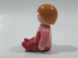 1990 Geobra Playmobil Female Girl Pink Shirt Red Pants Sitting 1 1/2" Tall Toy Figure