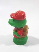 Green Crocodile Character with Red Hat and Brown Backpack 2 3/8" Tall Toy Figure