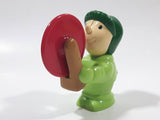 Man wearing Green Holding Red Plastic Saw 3" Tall Plastic Toy Figure