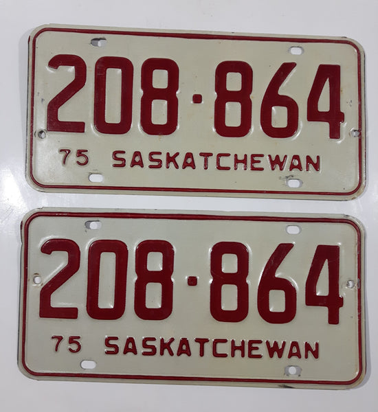Set of Matching Vintage 1975 Saskatchewan Red Lettering White Vehicle License Plate Metal Tags 208 864