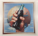 1993 The Coca Cola Company Earth Hand Holding A Bottle 13" x 13" Square Tin Metal Sign