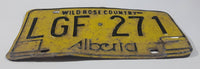 Vintage 1975 to 1984 Alberta Wild Rose Country Black Lettering Yellow Vehicle License Plate Metal Tag LGF 271