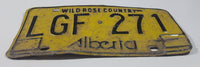 Vintage 1975 to 1984 Alberta Wild Rose Country Black Lettering Yellow Vehicle License Plate Metal Tag LGF 271