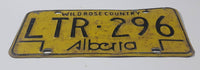 Vintage 1975 to 1984 Alberta Wild Rose Country Black Lettering Yellow Vehicle License Plate Metal Tag LTR 296
