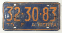 Vintage 1973 Alberta "F" Farm Orange Lettering Dark Blue Vehicle License Plate Metal Tag 32 30 83