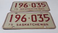 Set of Matching Vintage 1975 Saskatchewan Red Lettering White Vehicle License Plate Metal Tags 196 035