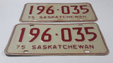 Set of Matching Vintage 1975 Saskatchewan Red Lettering White Vehicle License Plate Metal Tags 196 035