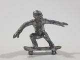 2011 NE-Rom Inc Miniature Silver Skateboarder 1 1/2" Tall Plastic Toy Figure