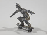 2011 NE-Rom Inc Miniature Silver Skateboarder 1 1/2" Tall Plastic Toy Figure