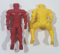 Red and Yellow Toy Action Figures in Seated Like Riding Positions