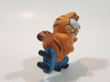 Vintage 1978 1981 United Features Syndicate Garfield Roller Skating 2 1/4" Tall PVC Toy Figure Made in Hong Kong