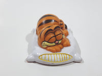 Vintage 1978 1981 United Features Syndicate Garfield Laying Sleeping On A White Pillow 2 1/2" Long PVC Toy Figure Made in Hong Kong