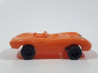 Vintage Goodyear Orange Plastic Toy Car Vehicle 2 1/2" Long Made in Hong Kong