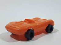 Vintage Goodyear Orange Plastic Toy Car Vehicle 2 1/2" Long Made in Hong Kong