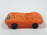 Vintage Goodyear Orange Plastic Toy Car Vehicle 2 1/2" Long Made in Hong Kong