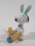 United Feature Peanuts Snoopy Easter Bunny Pushing Wheelbarrow Of Eggs with Woodstock 2 3/4" Tall PVC Toy Figure
