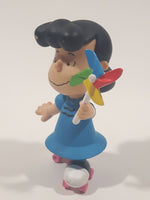 JP Just Play PNTS Peanuts Lucy Wearing Roller Skates Holding Rainbow Wind Pinwheel 3" Tall Vinyl Toy Figure