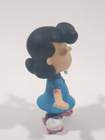 JP Just Play PNTS Peanuts Lucy Wearing Roller Skates Holding Rainbow Wind Pinwheel 3" Tall Vinyl Toy Figure