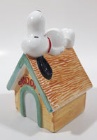 Peanuts Snoopy Laying On His Doghouse 5" Tall Ceramic Coin Bank