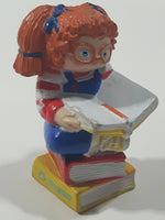 1984 OAA Panosh Place Cabbage Patch Kids Red Hair with Pigtails Sitting On Books Reading A Book 2 1/2" Tall PVC Toy Figure