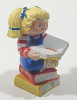 1984 OAA Panosh Place Cabbage Patch Kids Blonde Hair with Pigtails Sitting On Books Reading A Book 2 1/2" Tall PVC Toy Figure