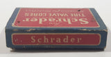 Antique 1930s Schrader Tire Valve Cores Box with Two Valves left