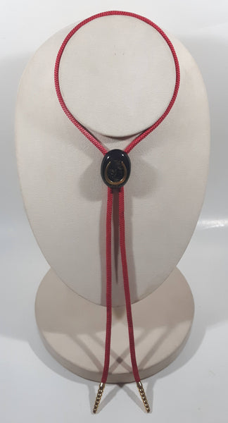 Western Gold Horse Shoe in Black Oval Red Draw String Bolo Tie