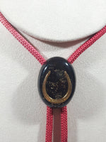 Western Gold Horse Shoe in Black Oval Red Draw String Bolo Tie