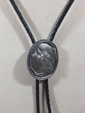 1987 Siskiyou Western Horse Head Outlined in Rope Pewter Metal Oval Shaped Black Draw String Bolo Tie