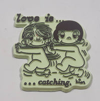 Vintage 1970 United Features Syndicate Kim Casali "Love is ..." "... catching." Light Green Rubber Fridge Magnet